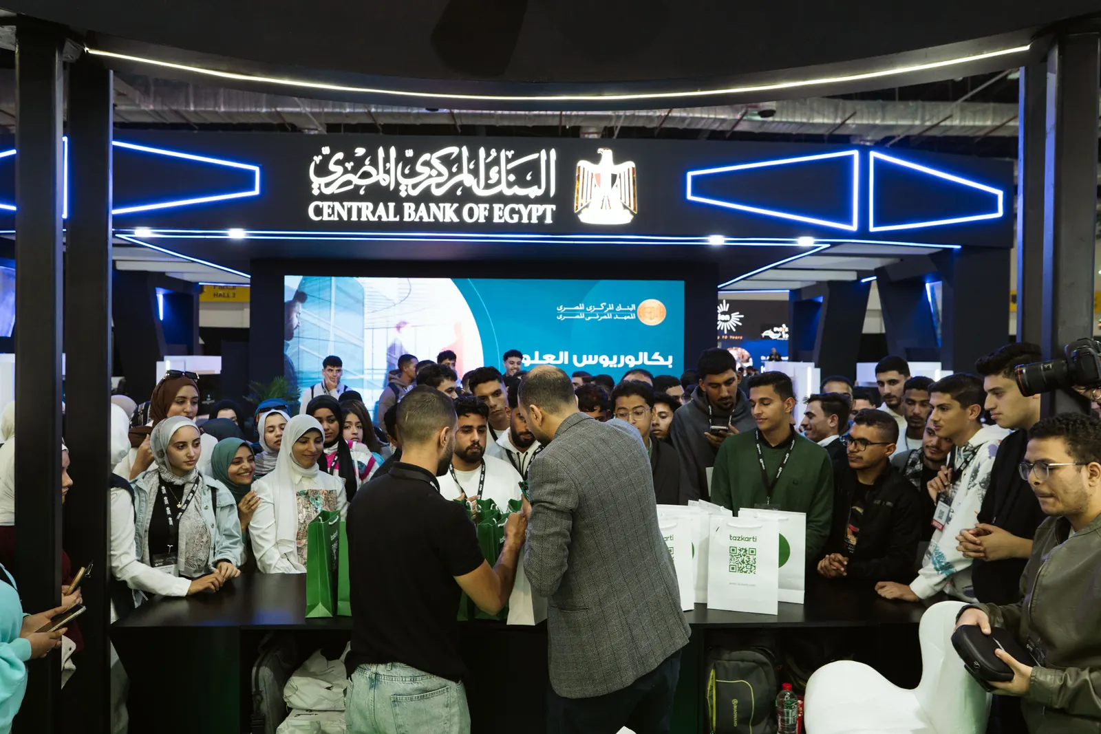 Visitors crowding the Central Bank of Egypt stand in the youth hall, PAFIX 2025