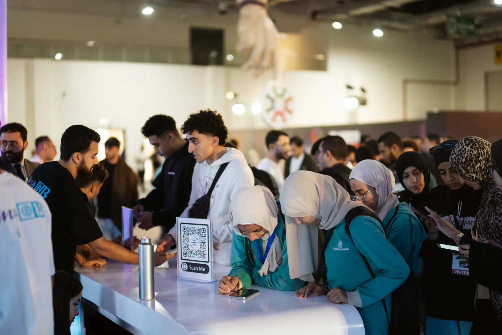 Young visitors crowding a stand in Connecta, the startup hub, 2025