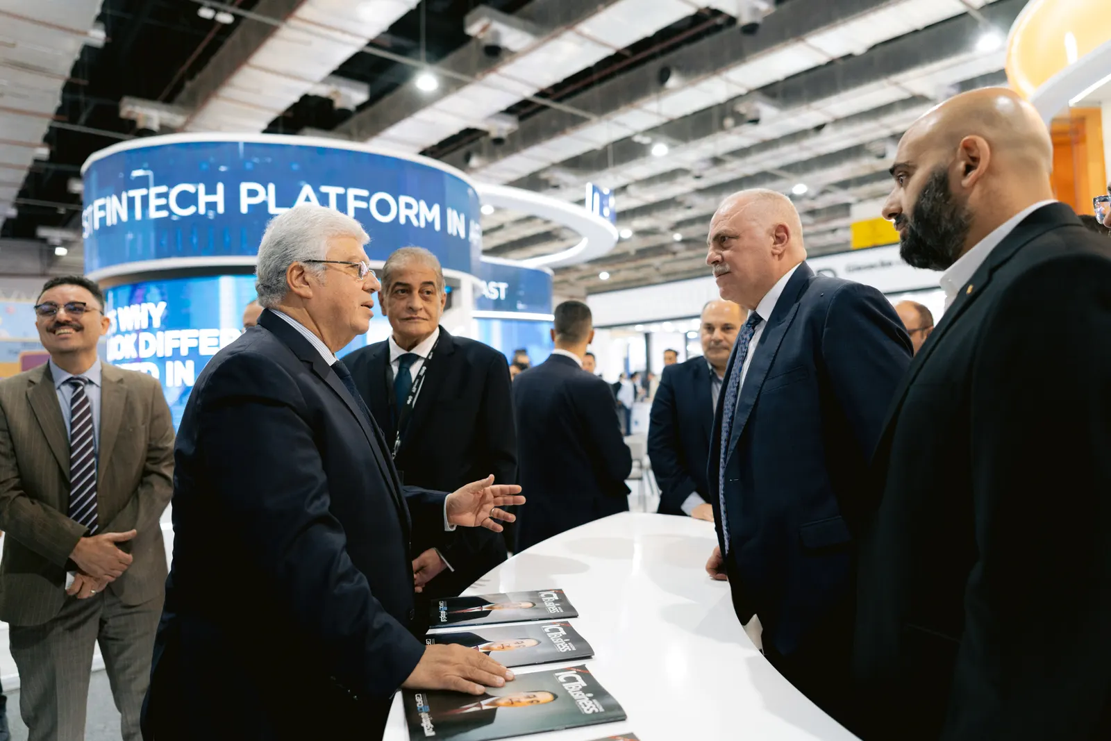 Officials touring a fintech platform pavilion at PAFIX 2025