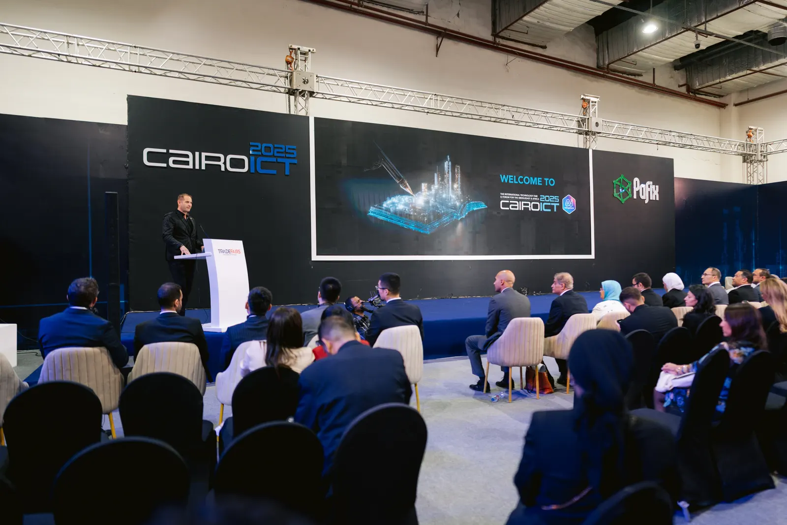 A keynote on the PAFIX forum stage at PAFIX 2025, a full hall in front