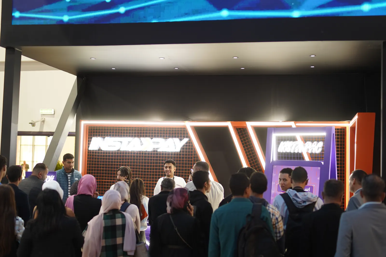 Visitors queueing at the InstaPay stand, PAFIX 2025