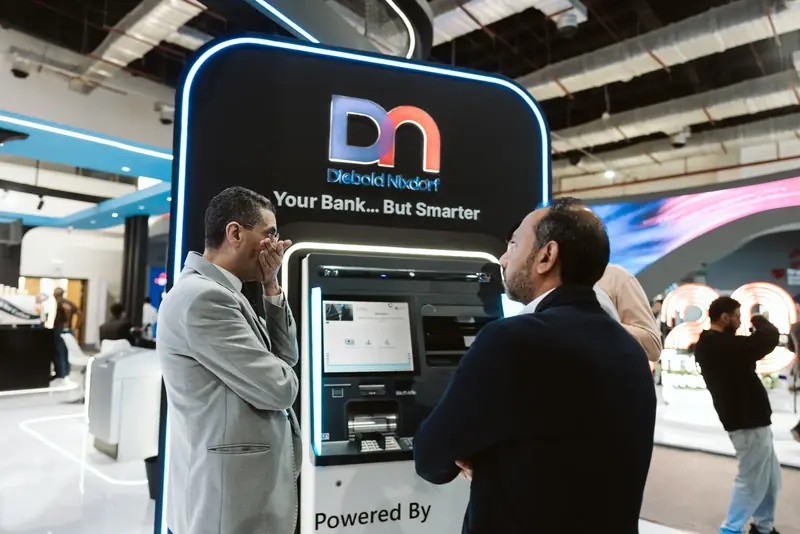 A digital banking kiosk demonstration at the Diebold Nixdorf stand, PAFIX 2025